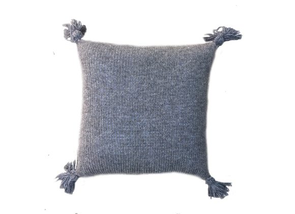 Knitted cushion with tassels